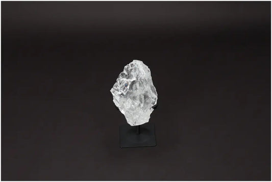 Rough Lemurian Quartz on metal stand, a premium Sylvia Crystals' product, harmonizes and balances energy, perfect for body and mind purification.