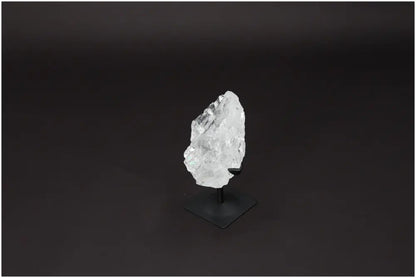 Rough Lemurian Quartz displayed on elegant metal stand, offering powerful energy harmonization and aesthetic appeal.
