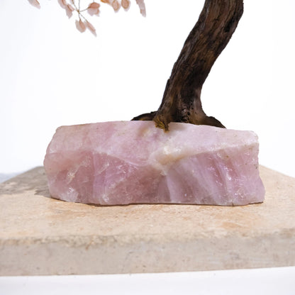 Quartz Crystal Bonsai Tree base with pink rough quartz gemstone and handcrafted wire branches, enhancing home décor and positive energy.