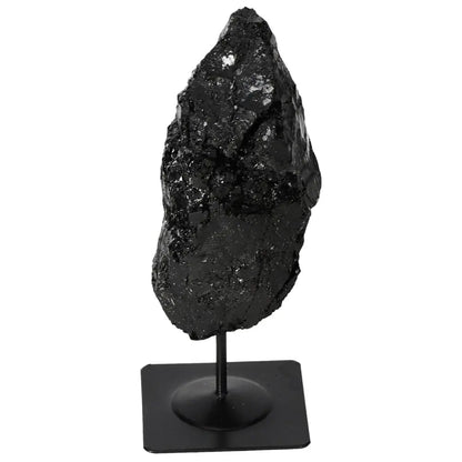 Rough tourmaline with metal stand, exclusive Sylvia Crystals design, enhances interiors with its unique charm and mystical benefits.