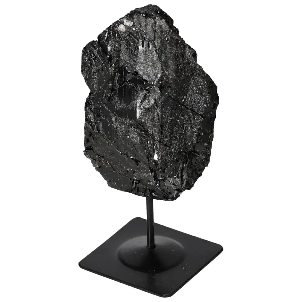 Rough tourmaline with metal stand, premium Sylvia Crystals design, enhances home decor, known for mystical benefits.