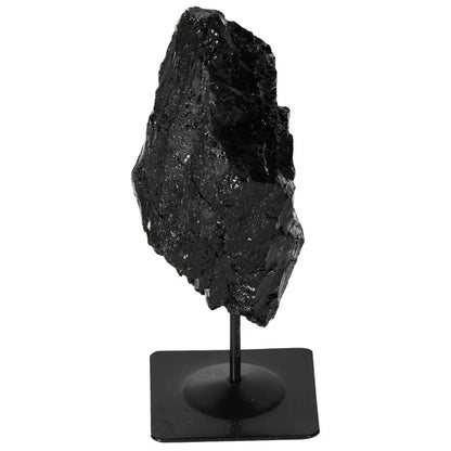 Rough tourmaline on metal stand, premium Sylvia Crystals design offering mystical benefits and visual charm, perfect for interiors.
