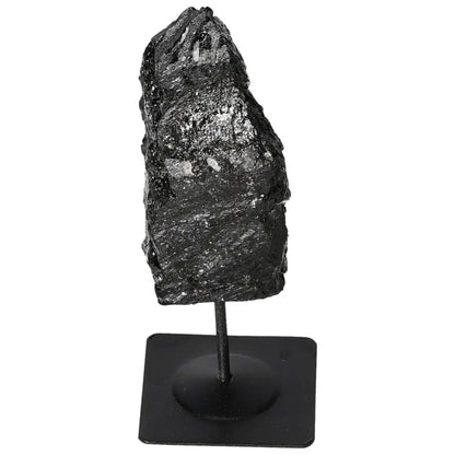 Rough black tourmaline on metal stand, showcasing natural charm and diverse colors, premium selection from Sylvia Crystals.