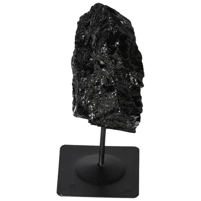 Rough Tourmaline on Metal Stand by Sylvia Crystals, showcasing its natural black luster. Ideal for crystal collectors.