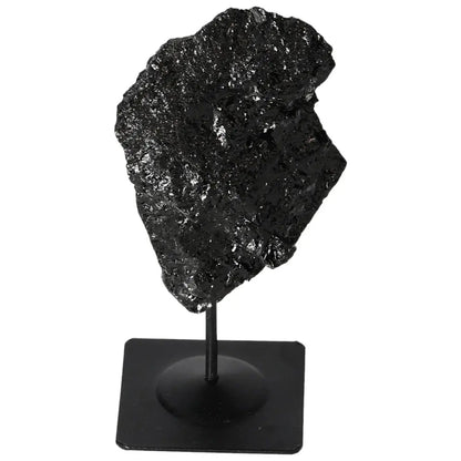 Rough black tourmaline crystal showcased on a metal stand from Sylvia Crystals.