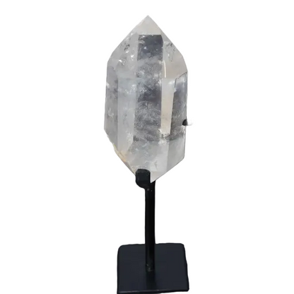 Semi polished clear quartz point on a stand for energy amplification and alignment.
