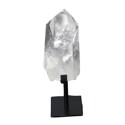 Semi polished clear quartz point with stand for energy clarity and alignment on a black background.