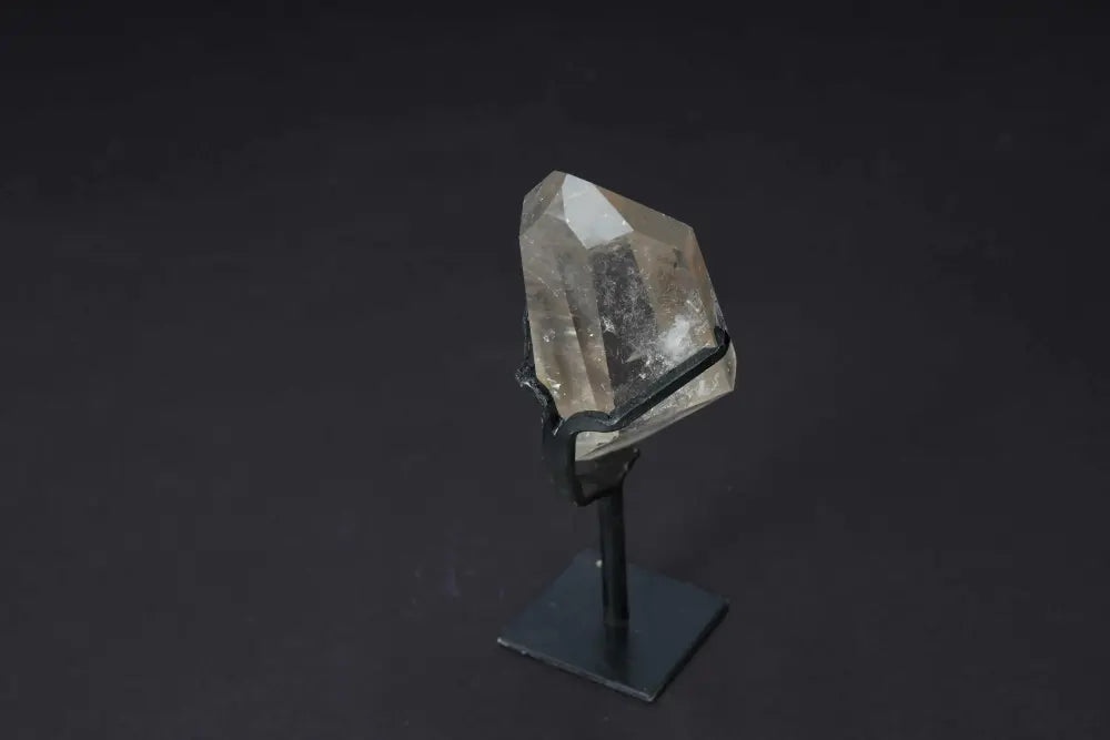 Semi-Polished Smoky Quartz Point on Stand, showcasing natural beauty and earthy tones, ideal for grounding and protection.