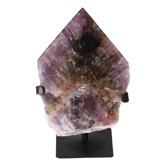 Seven Point Polished Amethyst crystal from Sylvia Crystals, known for stress-relief, displayed on a stand, with a purple and earthy hue.