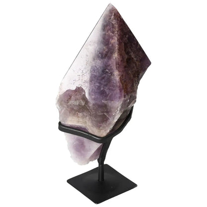 Seven Point Polished Amethyst from Sylvia Crystals displayed on a stand, showcasing its premium quality and tranquil beauty.