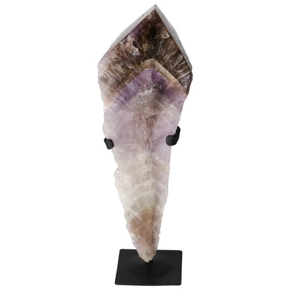 Seven Point Polished Amethyst gemstone by Sylvia Crystals, enhancing beauty and promoting emotional stability, on a black stand.