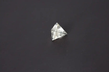 Smoky Quartz Pyramid 4 cm on dark background, showcasing grounding and neutralizing energy properties in a beautifully carved form.
