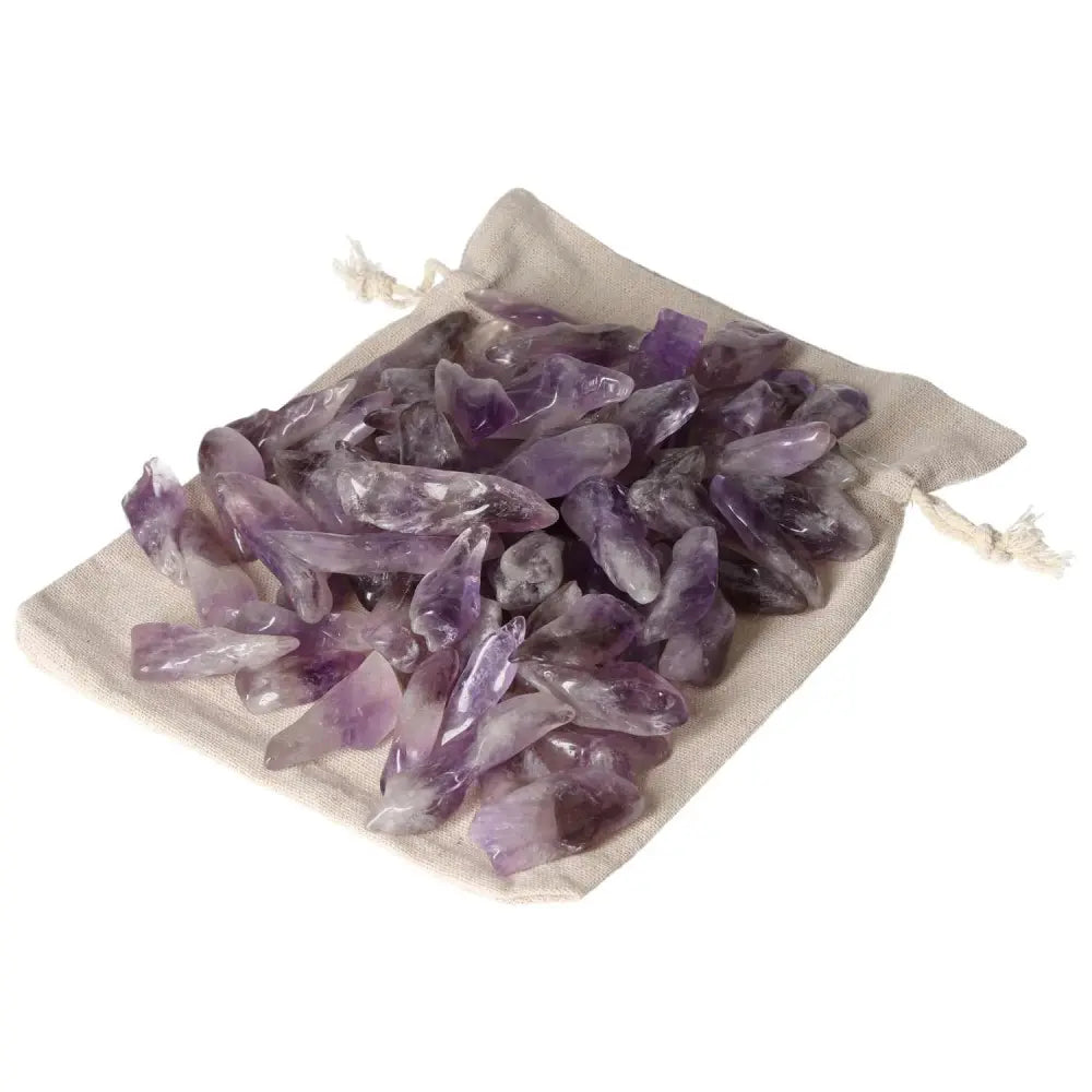 Bag of tumbled amethyst stones from Sylvia Crystals, featuring deep purples and white veins, known for stress relief and energy flow enhancement.
