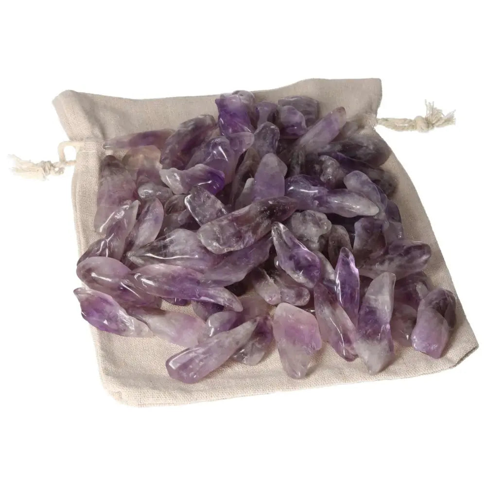 Tumbled Amethyst gemstones in a drawstring pouch, featuring vibrant deep purples and subtle white veins, by Sylvia Crystals.