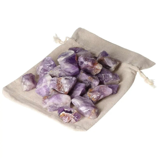 Tumbled Chevron Amethyst stones in beige pouch, showcasing unique purple patterns, available in 1KG 20PCS from Sylvia Crystals.