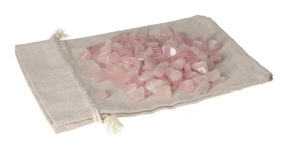 Tumbled Rose Quartz stones on a beige cloth bag, symbolizing emotional healing and unconditional love.
