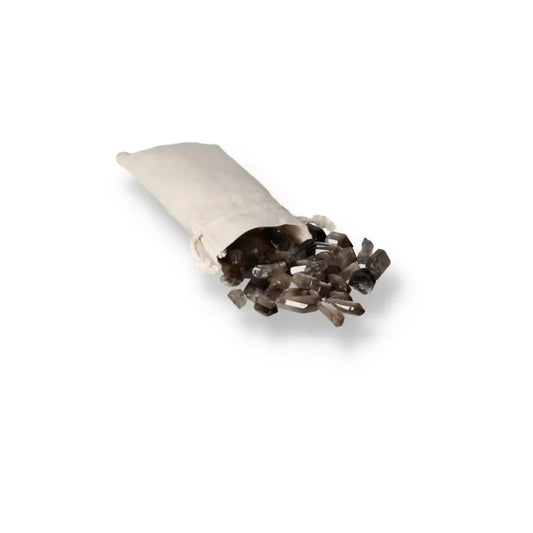 Tumbled Smoky Quartz Points from Sylvia Crystals spilling from a white pouch, ideal for grounding and enhancing practical thinking.