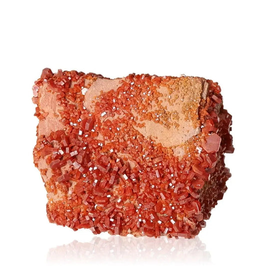 Vanadinite Druze, vibrant red-orange mineral for focus and creativity, featuring unique crystal formations and grounding properties.