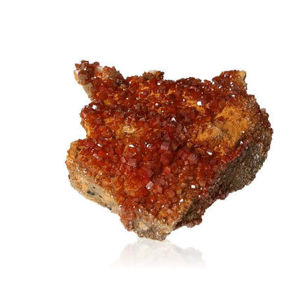 Vibrant red-orange Vanadinite Druze crystal formation showcasing unique mineral texture for focus and creativity enhancement.