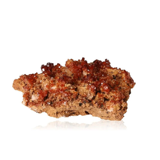 Vibrant red-orange Vanadinite Druze crystal, known for enhancing focus and creativity, perfect for mineral collectors and enthusiasts.