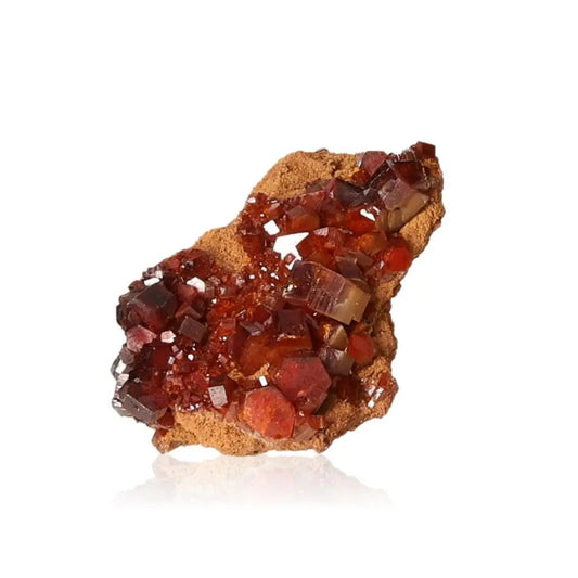 Vibrant red-orange Vanadinite Druze crystal formation showcasing unique mineralogy for focus and creativity.