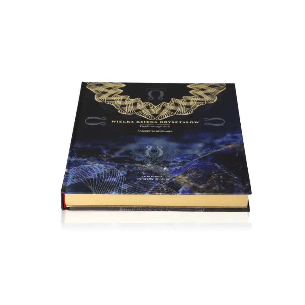 Wielka Księga Kryształów book by Katarzyna Bratumiła Baran, cover design featuring mystical crystal illustrations.