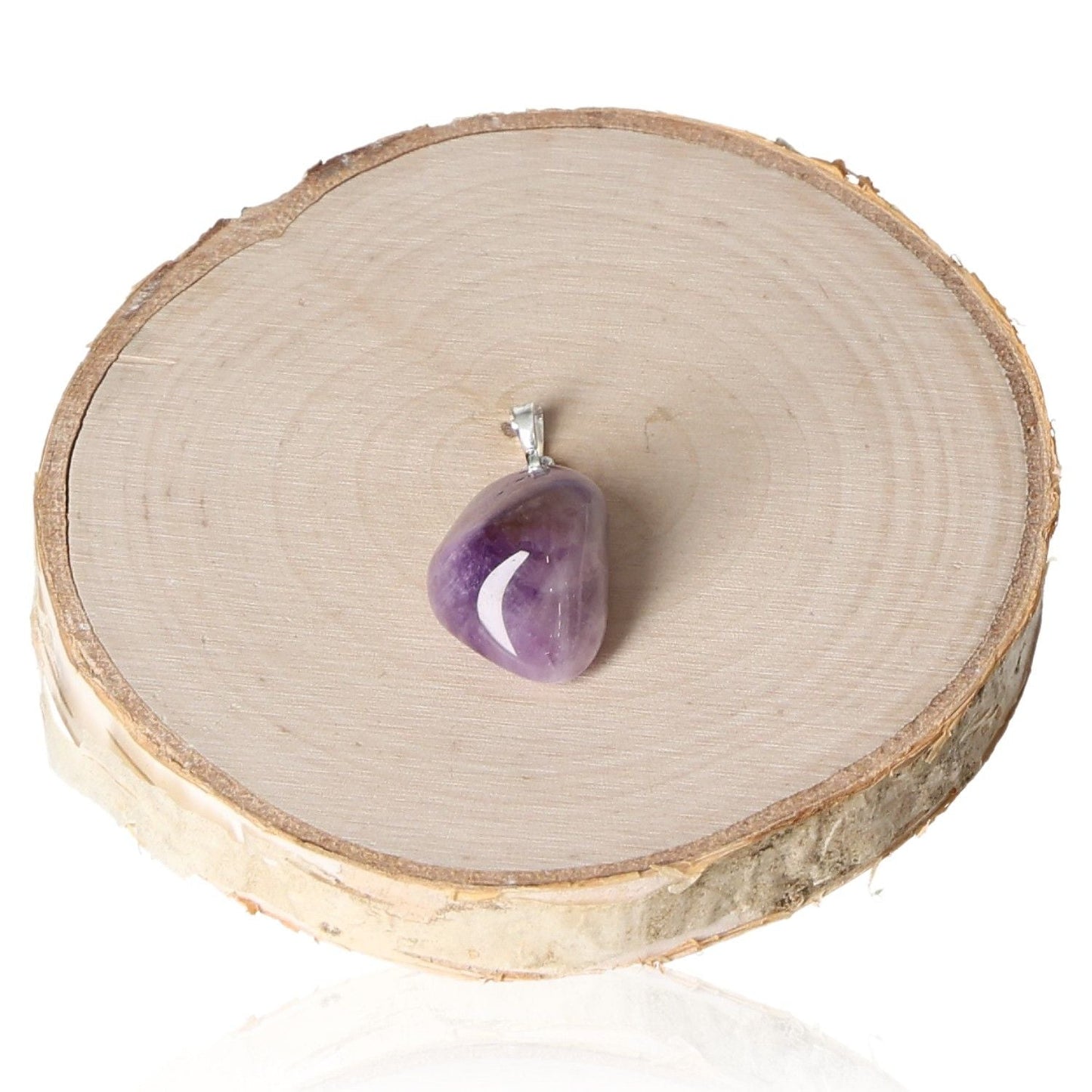 Amethyst Lavender Malawi Tumbled Pendant on wooden slice display.