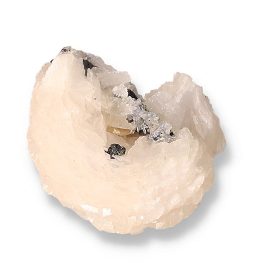 Raw white quartz crystal specimen with unique formations and black mineral inclusions on a white background.