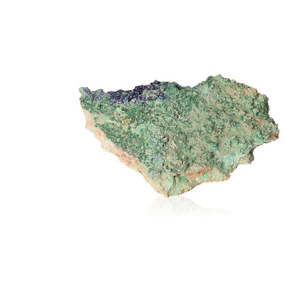 Raw malachite druze crystal with vibrant green hues on white background.