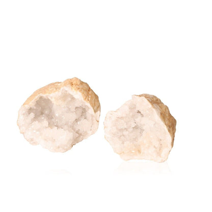 Milky quartz geode split open to reveal sparkling white crystals, known for enhancing tranquility and promoting positive energy.