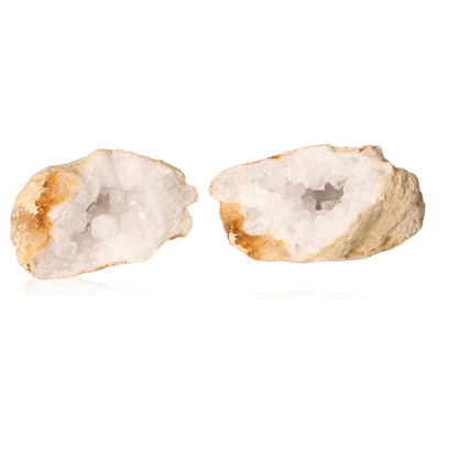 Milky quartz geode with earthy shell and cloudy white crystals, known for purifying energy and enhancing tranquility.