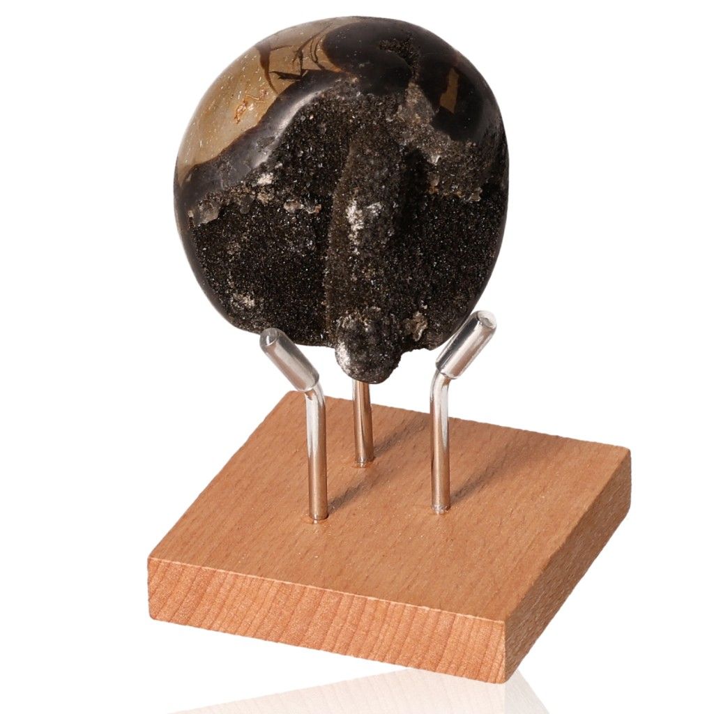 Septarian Dragon Stone on wooden stand, showcasing its unique mineral texture and colors.