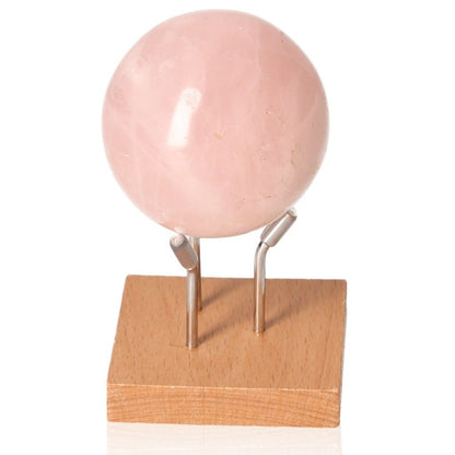 Rose Quartz Sphere on stand, symbolizing love and harmony, handcrafted from natural quartz for meditation and energy work.