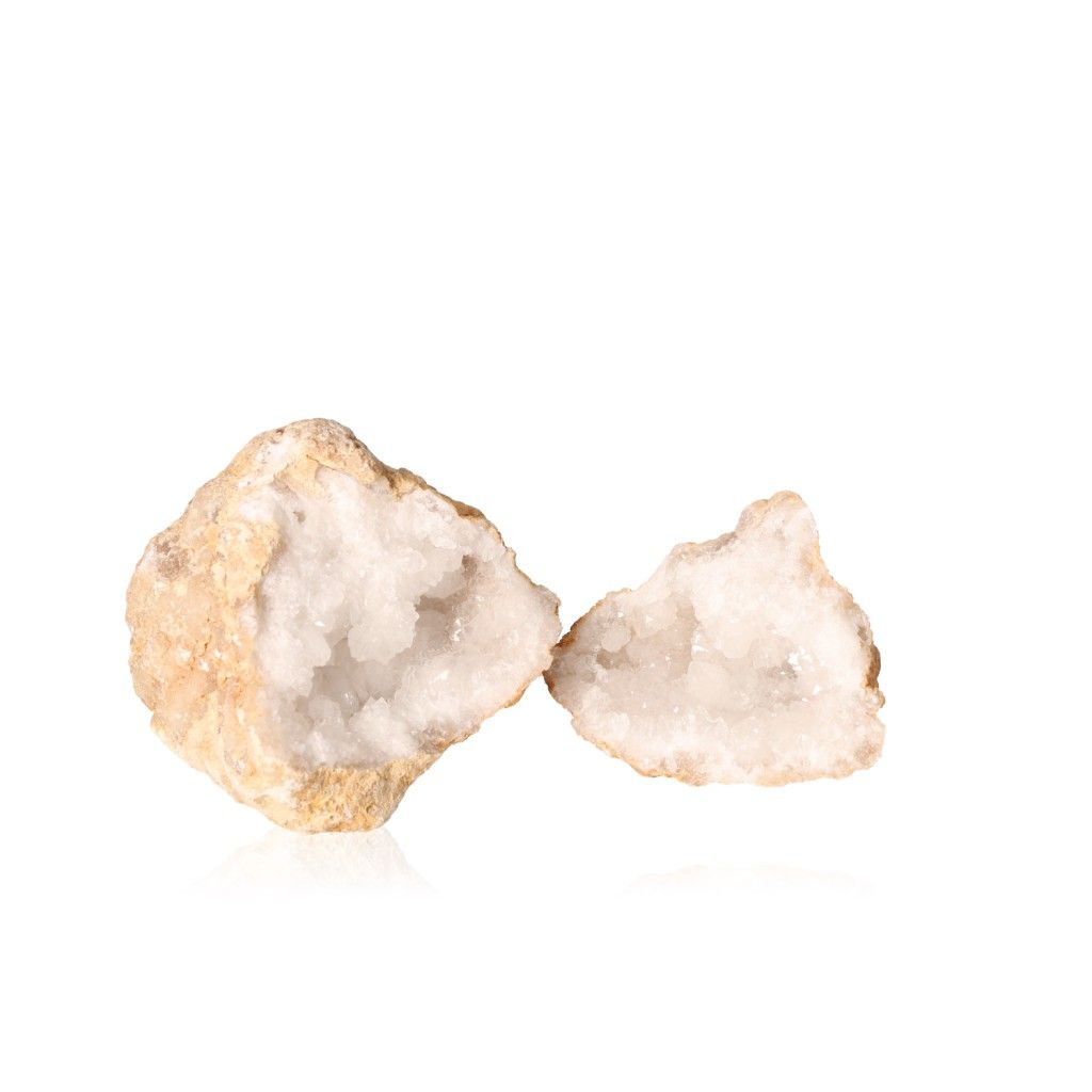 Milky quartz geode with an earthy shell and sparkling white crystals enhances tranquility and balance, promoting focus and positivity.