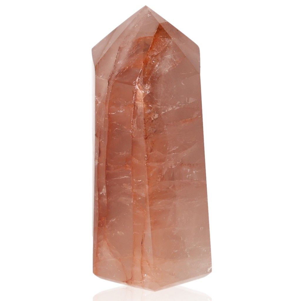 Red calcite tower crystal, enhancing energy and spiritual properties, associated with chakras and zodiac signs.