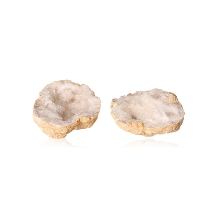 Milky quartz geodes with sparkling white crystals for energy purification and tranquility enhancement.