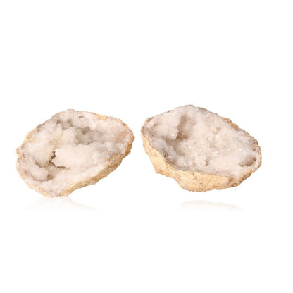 Quartz geode split open showing cloudy white crystals and rugged outer shell, ideal for energy balancing and boosting focus.