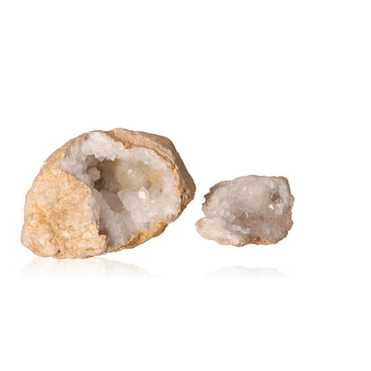 Milky quartz geode with earthy shell revealing sparkling white crystals, known for purifying energy and enhancing tranquility.