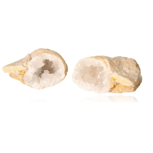 Milky quartz geode with white crystals, open to display its sparkling interior, enhances tranquility and energy balance.