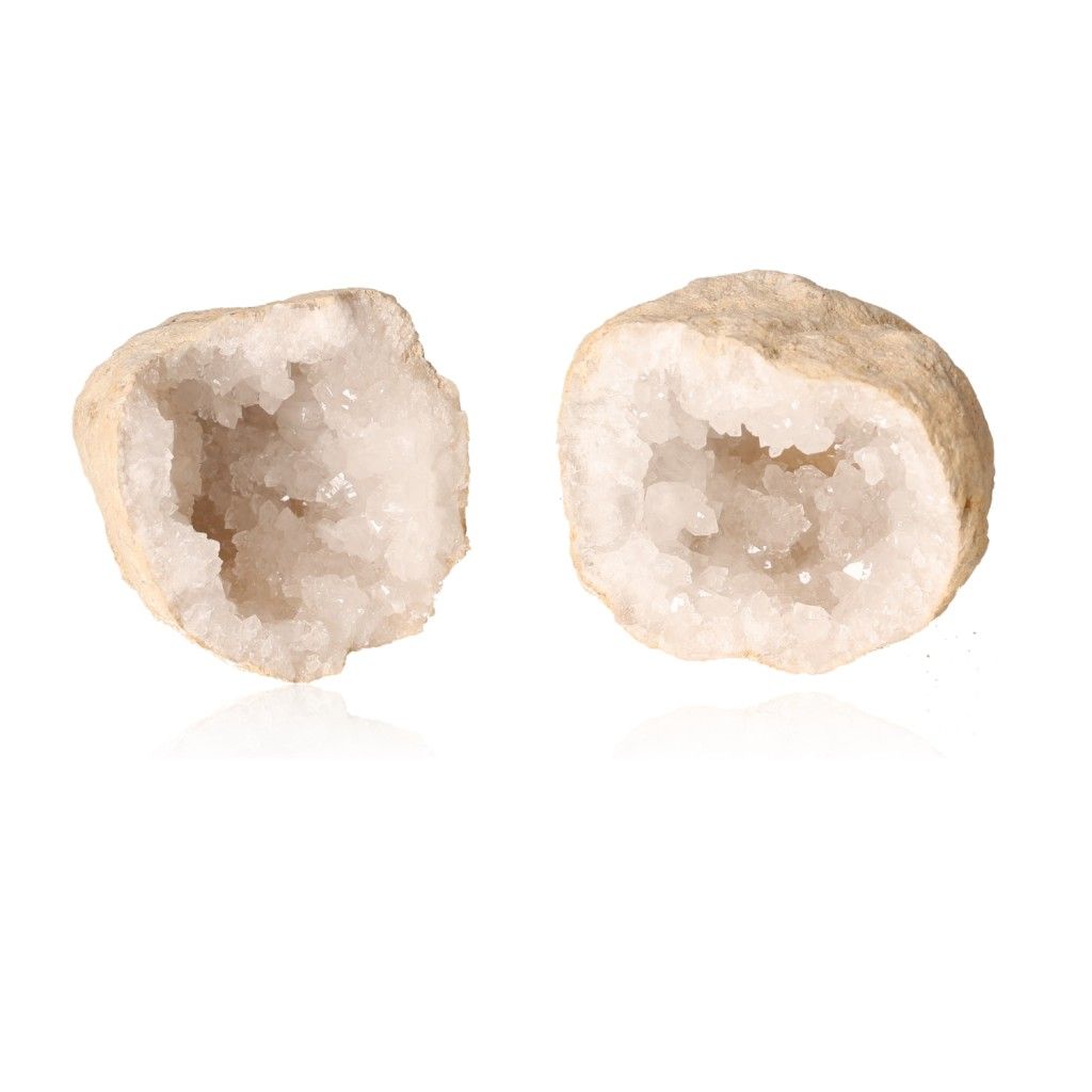 Milky quartz geode split open revealing sparkling white crystals, known for purifying energy and enhancing tranquility.