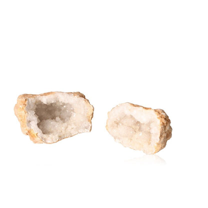 Milky quartz geode with earthy shell and sparkling white crystals, perfect for energy cleansing and enhancing tranquility.