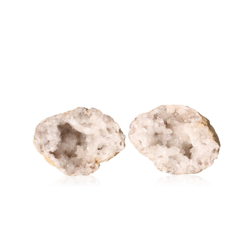 Quartz geode with milky white crystals, showcasing its earthy shell and sparkling interior.