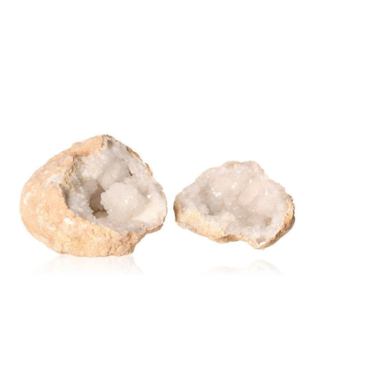 Milky quartz geode revealing sparkling cloudy white crystals, known for purifying energy and enhancing tranquility and clarity.