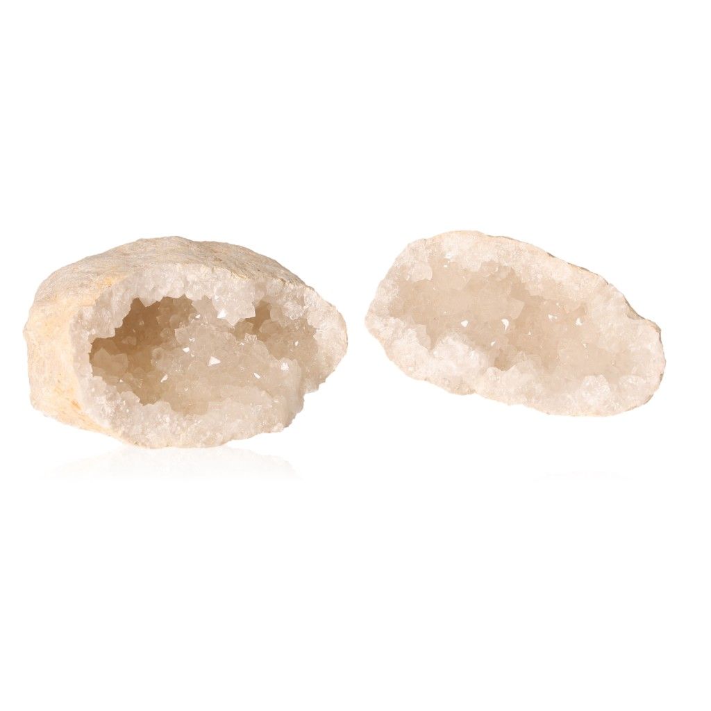 Milky quartz geode with sparkling white crystals, known for purifying energy and enhancing focus, split open to reveal inner beauty.