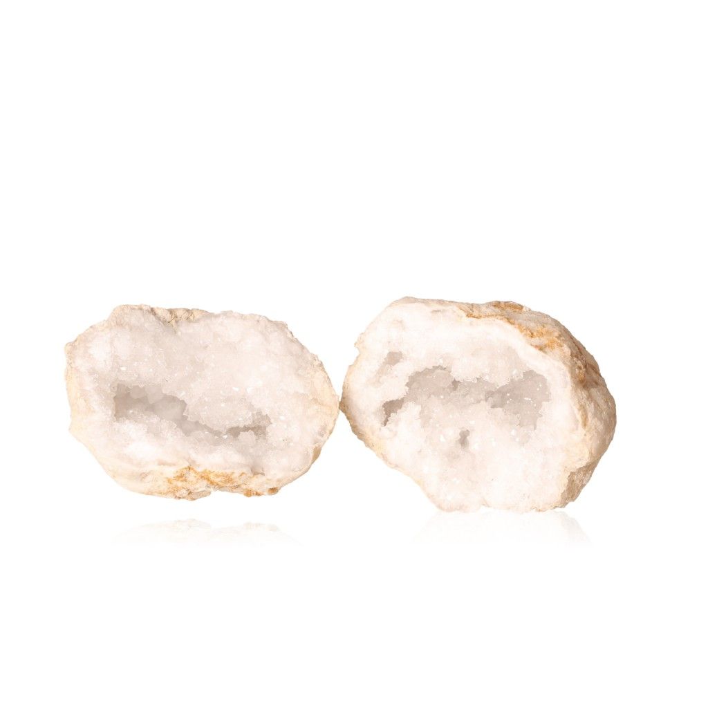 Milky quartz geode with sparkling white crystals and rugged outer shell, ideal for enhancing tranquility and energy balance.