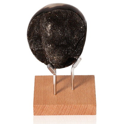 Septarian "Dragon Stone" on wooden display stand showcasing unique mineral properties and symbolism.