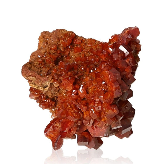 Vibrant Vanadinite Druze with hexagonal crystals and glassy surface, enhancing focus and motivation with bold reddish-orange hues.