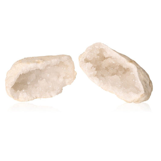 Milky quartz geodes with sparkling white crystals, known for purifying energy and enhancing tranquility and focus.