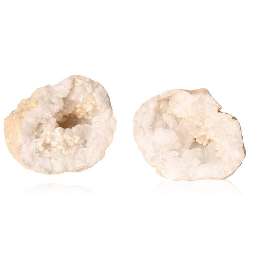 Milky quartz geodes with rugged shell and sparkling white crystals, ideal for enhancing tranquility and balancing energy.