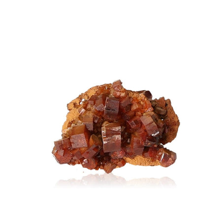 Vibrant reddish-brown Vanadinite Druze with hexagonal crystals and a glassy surface, enhancing focus and motivation.